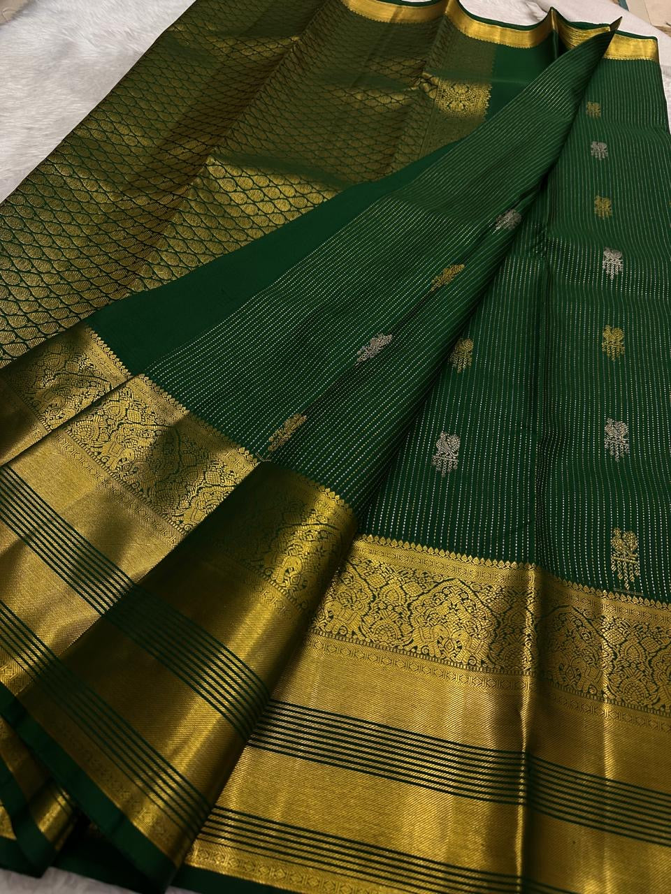 Fresh Leaf Green Kanchipuram Butta saree with Oosi Vaanam stripes.