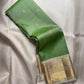 Fresh Leaf Green Kanchi Pattu Saree — pale silver-grey Korvai border with gold zari motifs