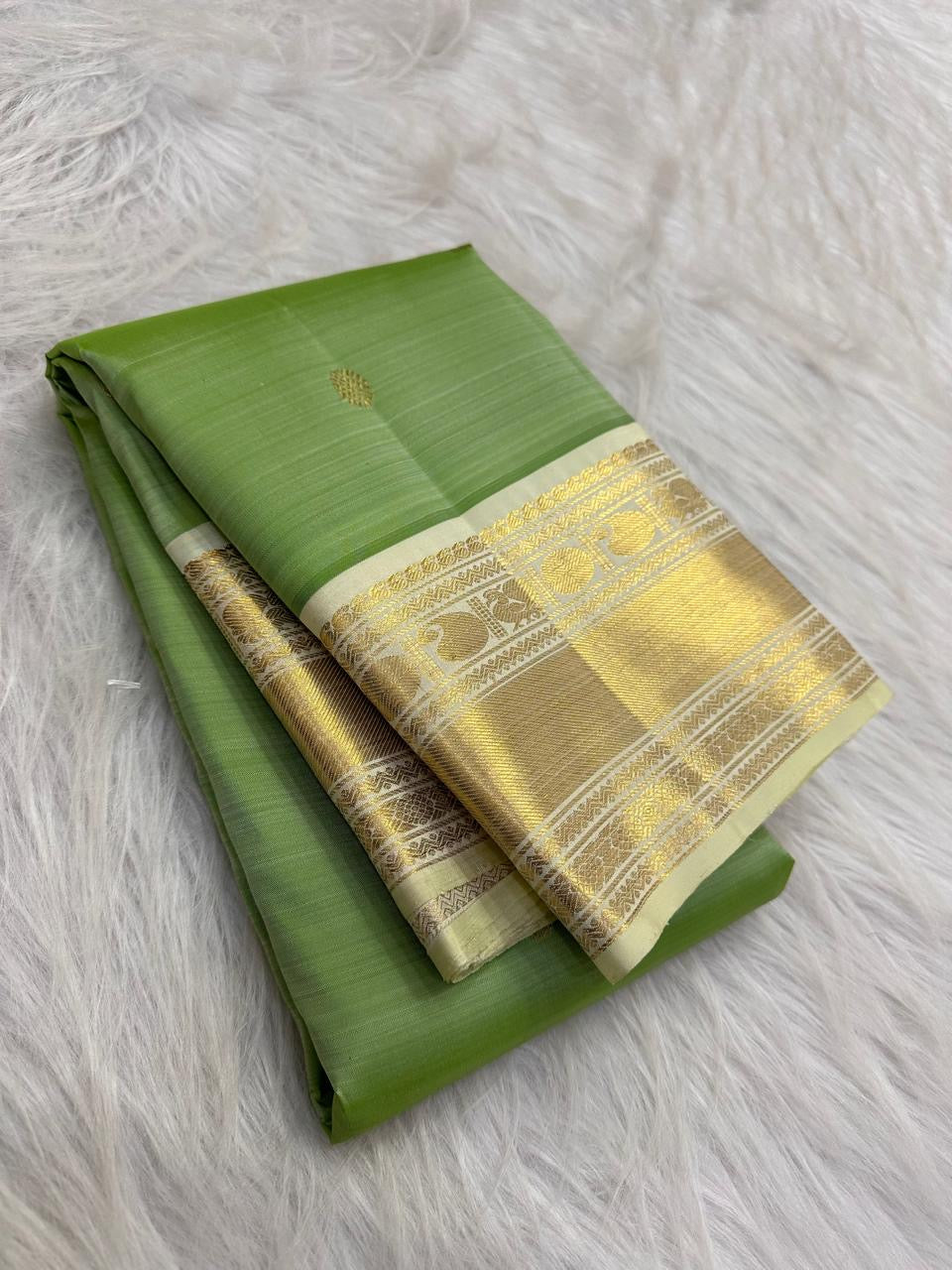 Fresh Leaf Green Pure Silk Kanchipuram Korvai saree with Warm Ivory gold zari Mayil border
