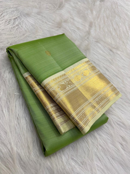 Fresh Leaf Green Pure Silk Kanchipuram Korvai saree with Warm Ivory gold zari Mayil border