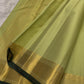 Fresh Pistachio Green Kanjivaram silk saree draped, full length view — Idam Living