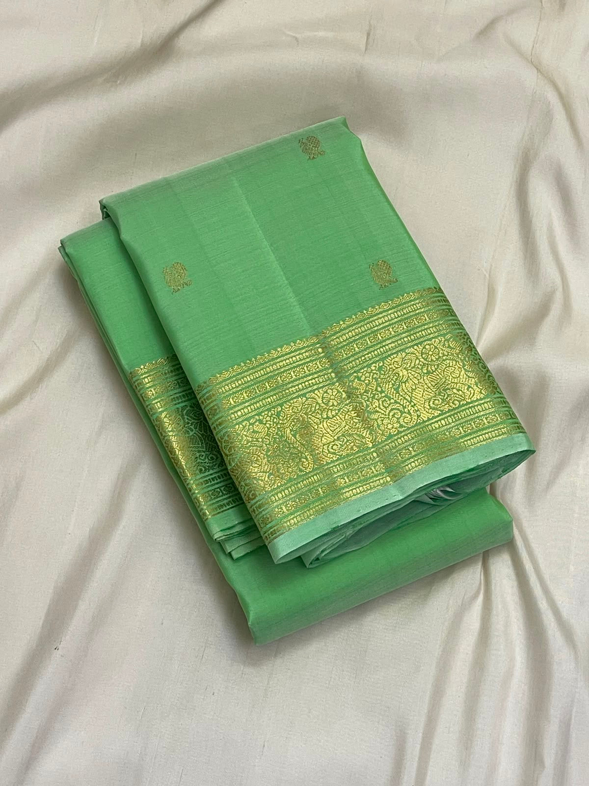Fresh Pistachio Green Kancheepuram silk saree draped, full length view — Idam Living