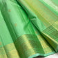 Fresh Pistachio Green Kancheepuram silk saree, gold zari butta motif close-up — Idam Living