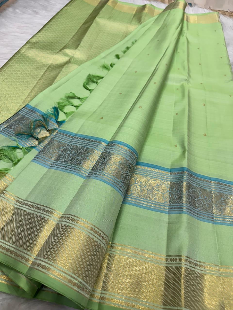 Fresh Pistachio Green Kanchi Pattu silk saree draped, full length view — Idam Living