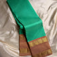 Kanchipattu silk saree in fresh turquoise green with sandal brown border Korvai Rettapet weave traditional zari detail