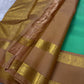 Kanchipattu silk saree in fresh turquoise green with sandal brown border Korvai Rettapet weave traditional zari detail