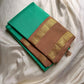 Kanchipattu silk saree in fresh turquoise green with sandal brown border Korvai Rettapet weave traditional zari detail