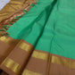 Kanchipattu silk saree in fresh turquoise green with sandal brown border Korvai Rettapet weave traditional zari detail