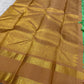 Kanchipattu silk saree in fresh turquoise green with sandal brown border Korvai Rettapet weave traditional zari detail