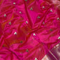 Close-up of a floral butta motif on fuchsia pink Pattu Silk Chanderi saree
