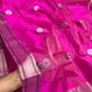 Fine dark parallel lines on the metallic border of a pink Chanderi silk saree.