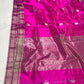 Broad rose-silver metallic woven pallu on a bright fuchsia Chanderi saree.