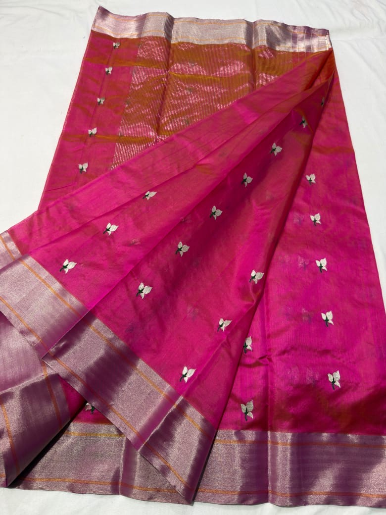Fuchsia pink Chanderi silk saree, silver-gold zari pallu draped over the shoulder