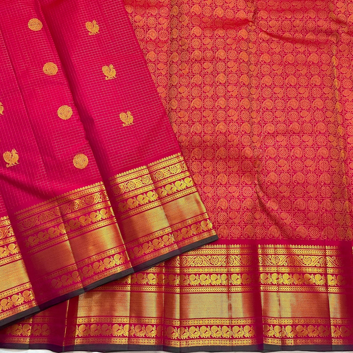 Fuchsia pink handwoven pure silk Kanchipuram Zari Kattam saree with Mayil Chakram zari motifs, full view