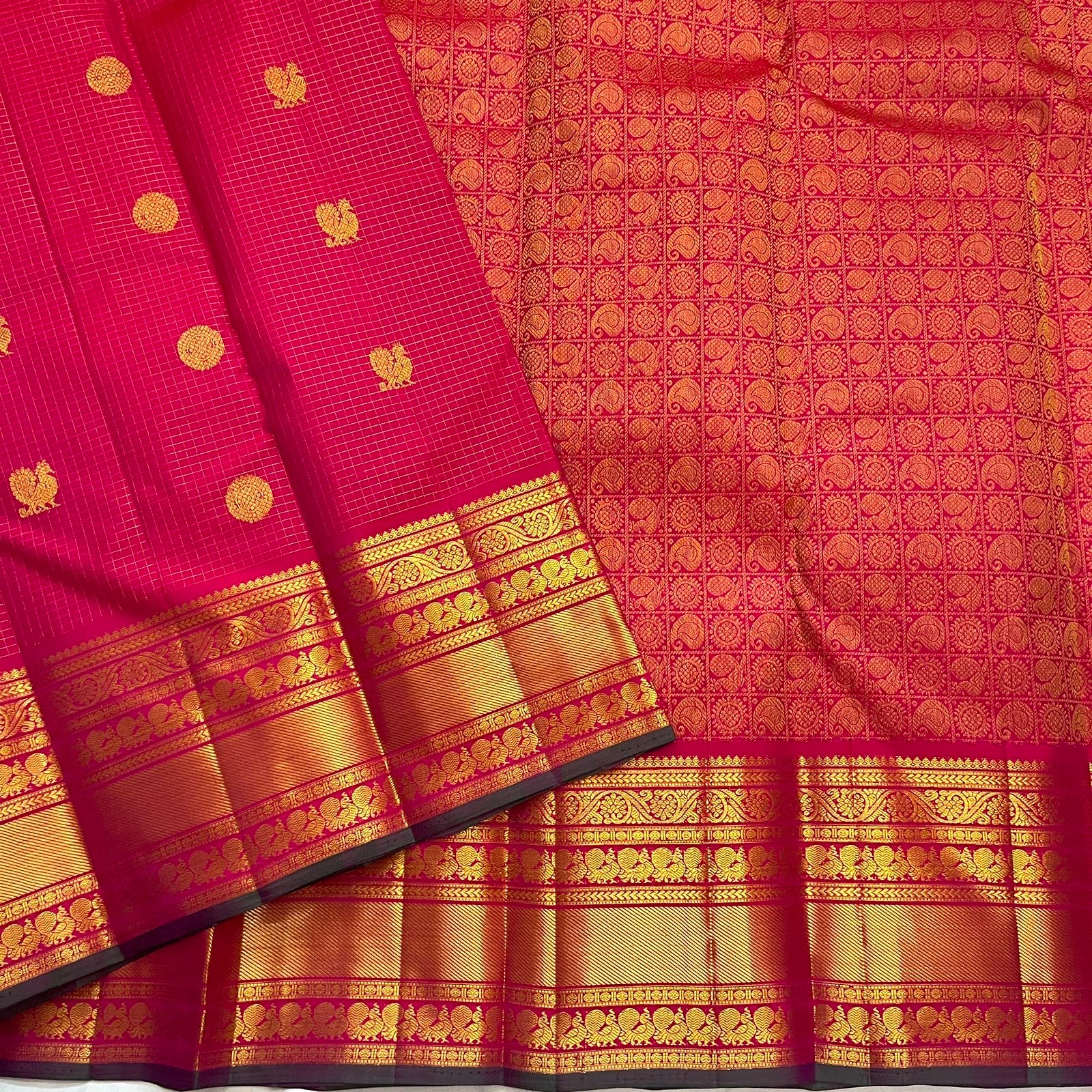 Fuchsia pink handwoven pure silk Kanchipuram Zari Kattam saree with Mayil Chakram zari motifs, full view