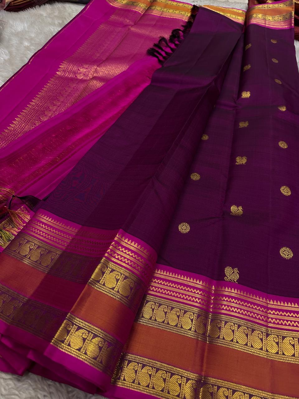 Fuchsia pink body detail showing larger gold zari buttas.
