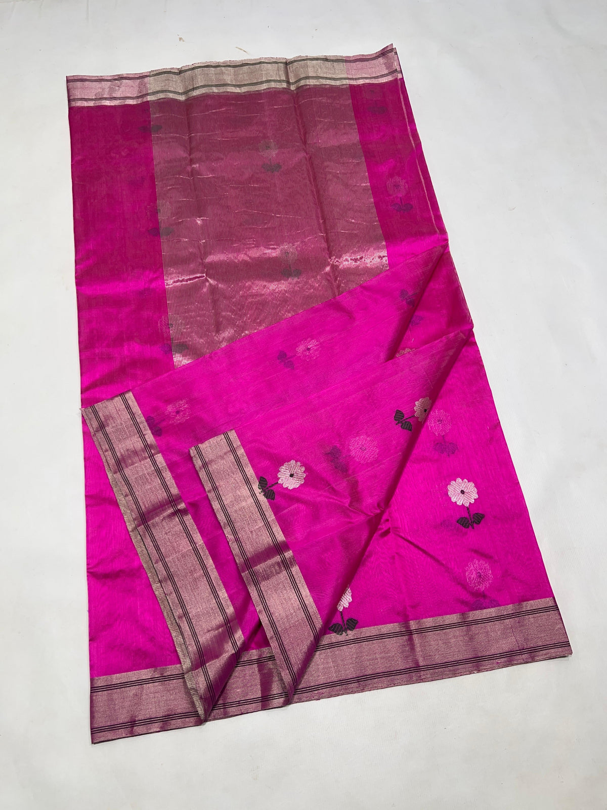 Lustrous vivid pink Pattu Silk Chanderi fabric showing tonal colour variation.