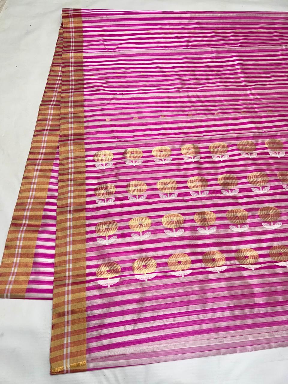 Fuchsia pink striped Chanderi saree with golden floral motifs from Idam Living