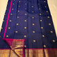 Navy and magenta Pure Kanchipuram silk saree spread showing gold elephant buttas, contrast pallu panel, and zari border, shipped from New Jersey USA.