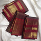 Deep Coffee Brown Pure Silk Kanchipuram Zari Kattam saree with Arakku Red Gandaberunda gold zari border.