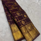 Deep aubergine Pure Silk Kanchipuram saree with gold Zari Kattam checks, handwoven Gandaberunda motifs and broad antique gold zari border.