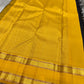 Close view of navy Kanchipuram silk saree featuring antique gold zari motifs and contrast Ganga Jamuna border