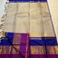 Gold beige KanchiPattu silk body close-up showing gold zari diamond lattice weave