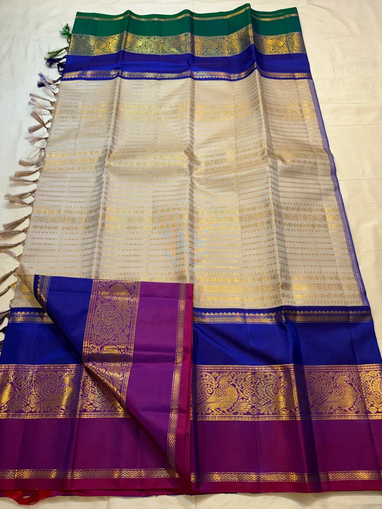Gold beige KanchiPattu silk body close-up showing gold zari diamond lattice weave