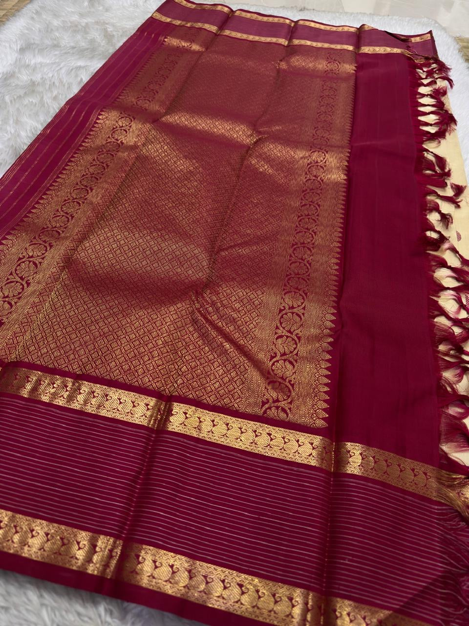 Deep rani pink rettapet border detail on gold beige KanchiPattu silk saree