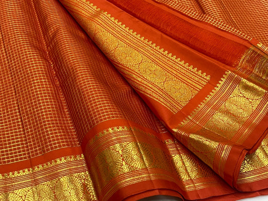 Burnt orange Kanchipuram silk saree with fine check pattern and antique gold zari woven border, pallu and body detail photo