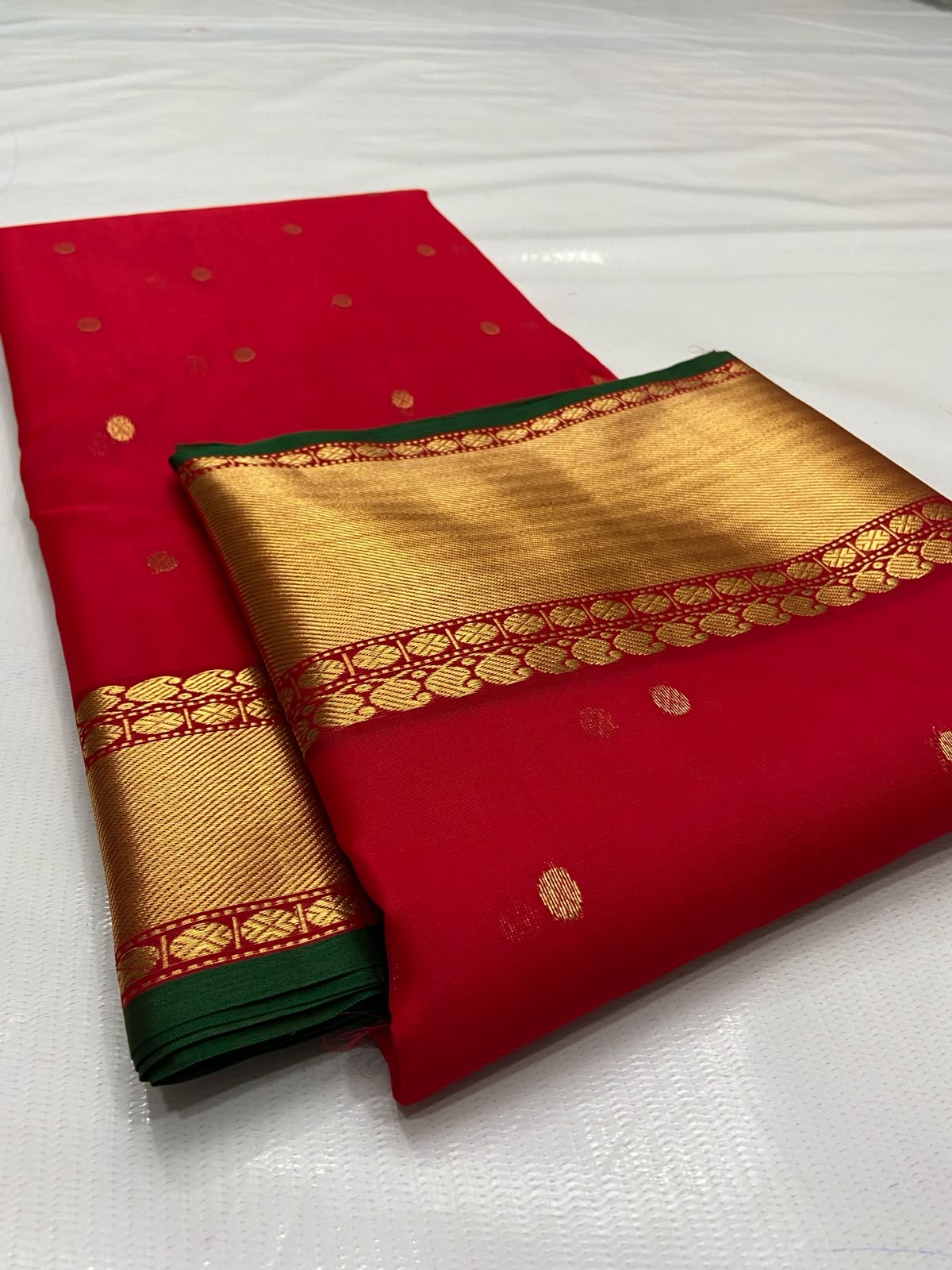 Red Chanderi saree with narrow deep green border edge