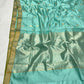 Detail of petite gold-toned buttas with tiny dark green accents on an Aqua Blue Katan Silk Chanderi saree