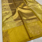 Turmeric Gold Chanderi saree border detail with large ornamental floral and foliage motifs on a mustard-gold ground