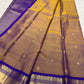 Gold Kanchipuram Korvai saree with royal violet zari border and Mayil Chakram buttas