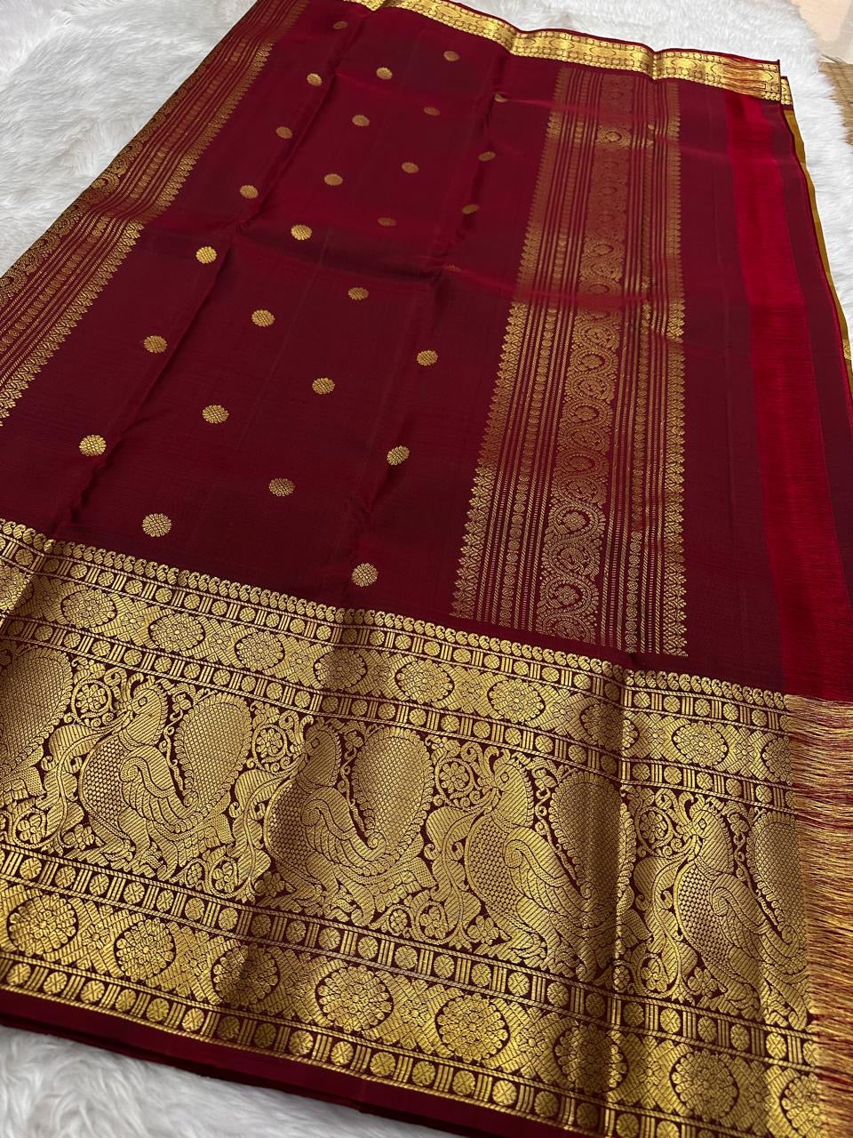 Mustard-gold Kanchipuram Zari Kattam with lotus-inspired Kamalam zari buttas.