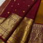 Traditional Kanchipuram silk saree in antique gold with deep maroon border and Gandaberunda weaving