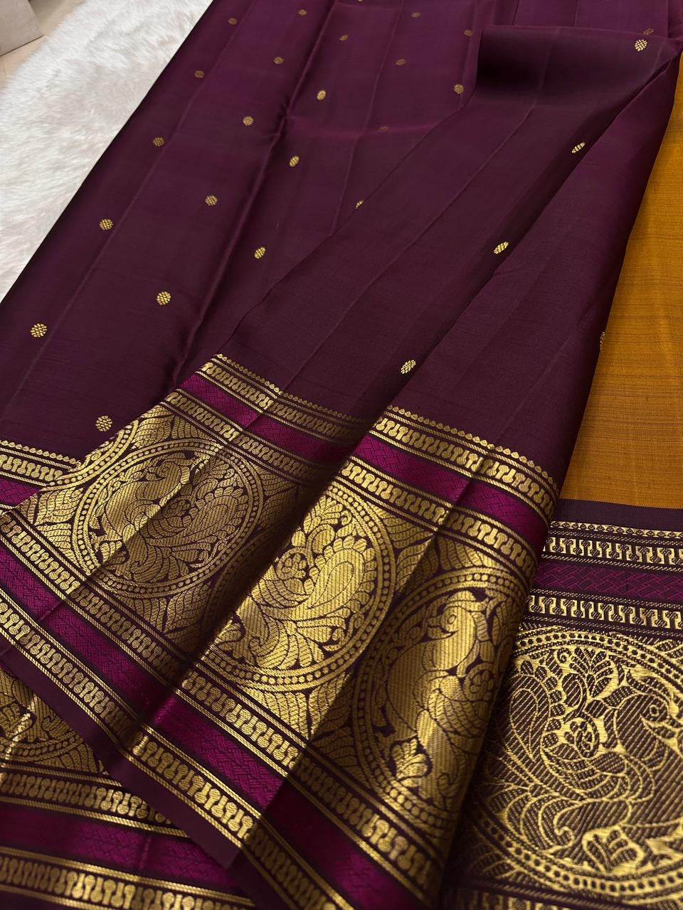 Antique gold Kanjeevaram silk saree with traditional zari close-up