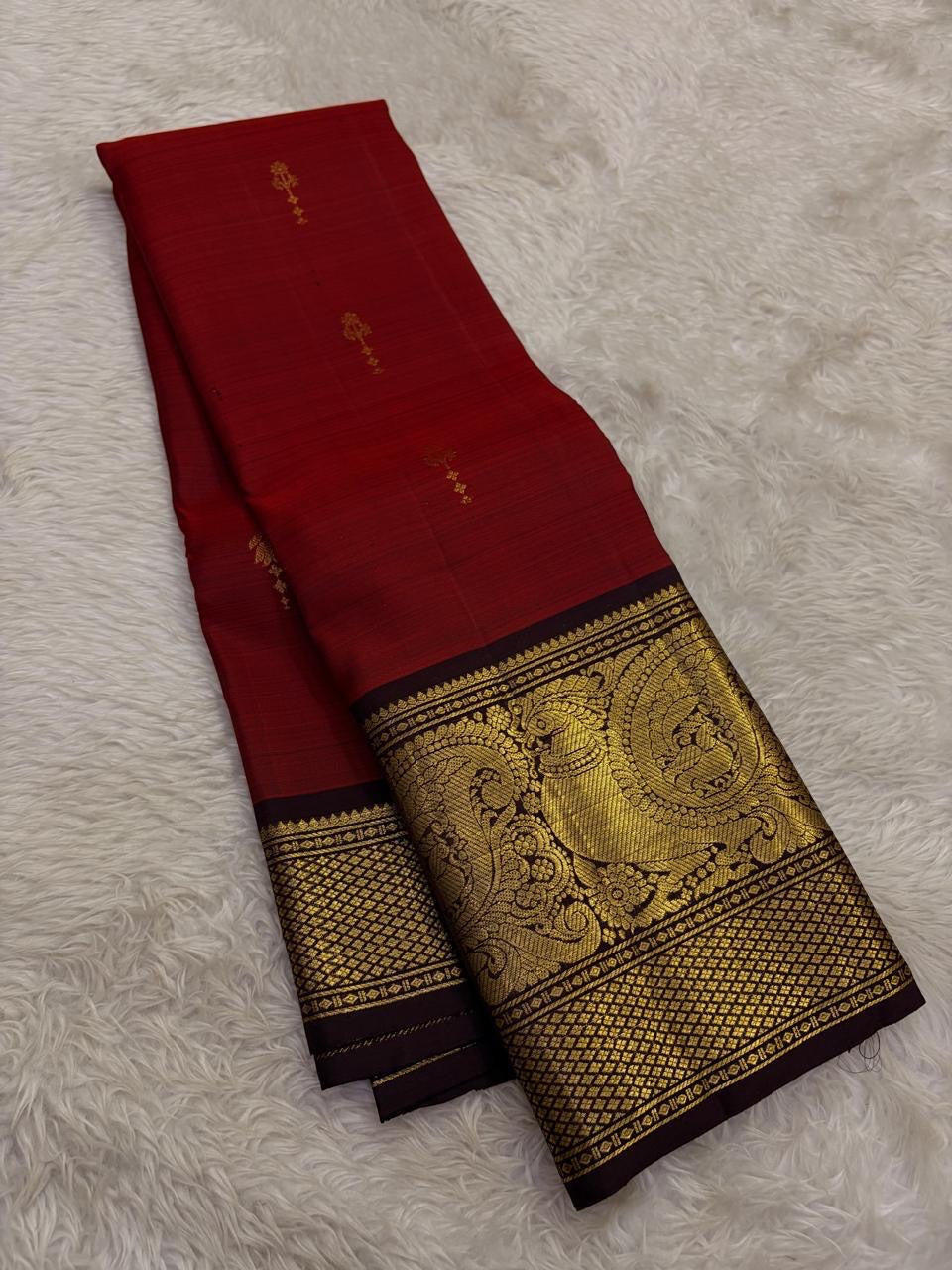 Vermilion Red Handwoven Pure Silk Kanjivaram Saree with Gold Buttas and Deep Brown Peacock Zari Border