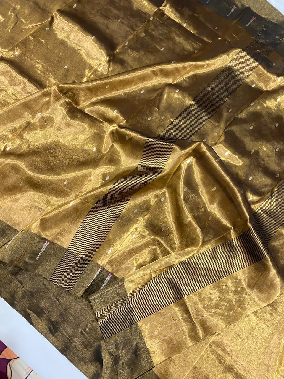 Antique Gold Tissue Silk Chanderi saree with deep olive-green border and metallic woven motifs