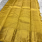 Folded border detail showing layered gold zari registers and richly woven ornamental motifs