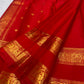 Gold zari buttas on the vermilion red KanchiPattu Rettapet saree, Yazhi border detail