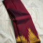 Gold zari Ettukol temple border detail on deep maroon Kanchipattu silk saree