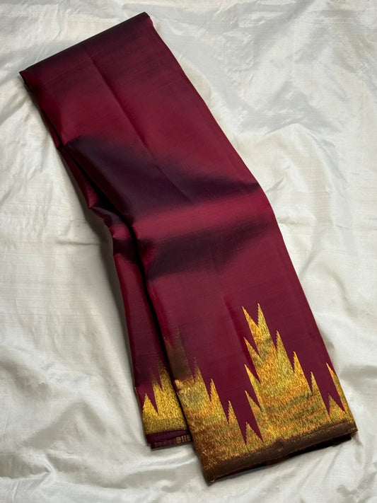 Gold zari Ettukol temple border detail on deep maroon Kanchipattu silk saree