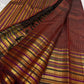 Gold zari lines on the deep cocoa maroon Kanchipuram Varisaipet saree body