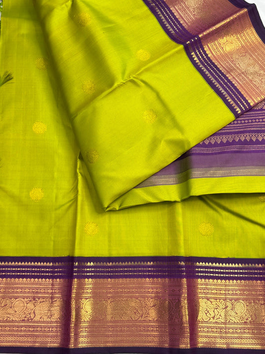 Gold zari Kamalam lotus butta detail on tender leaf green Kanchipuram pure silk saree