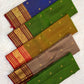 Broad traditional red border framing a golden green silk saree