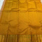 Handwoven ivory Kanjivaram saree with Mayil-inspired zari buttas