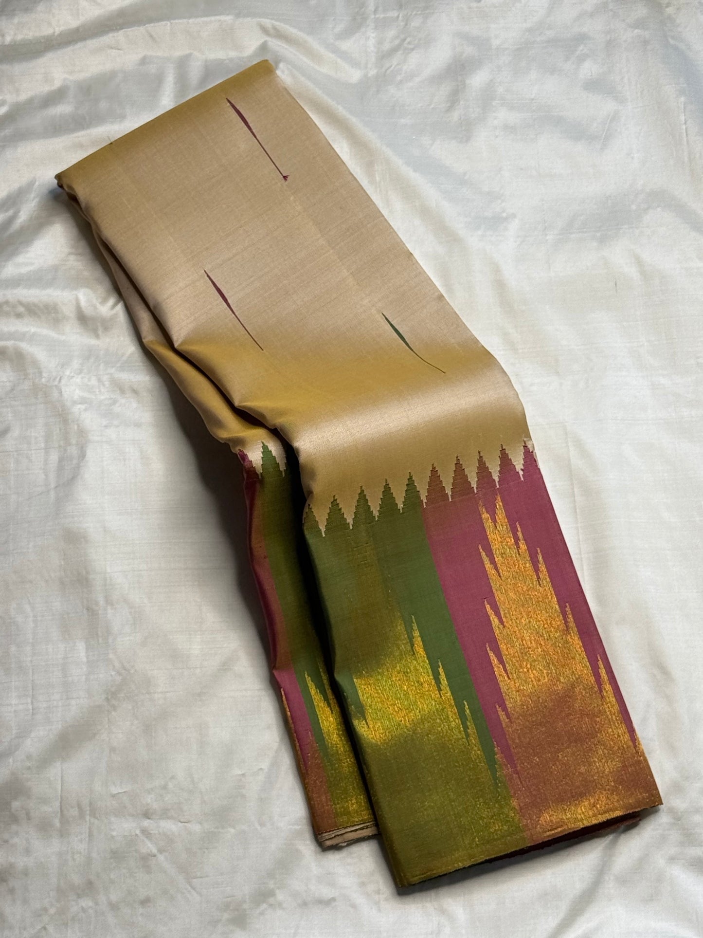Eight-flame ettukol motifs on golden ivory Kancheepuram silk saree border — Idam Living