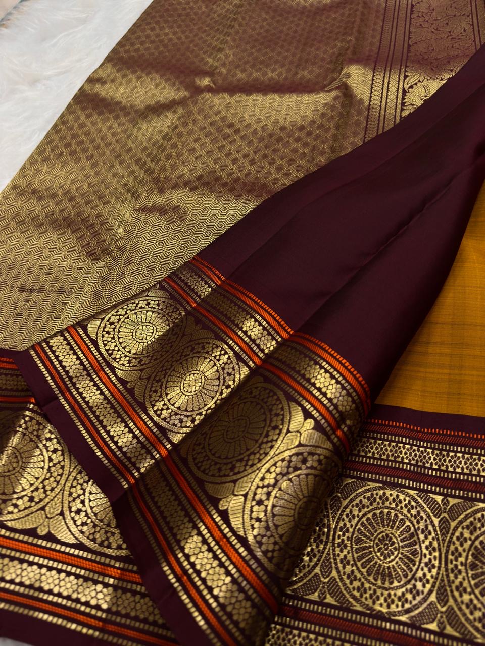 Golden Mustard Kanchi Pattu Saree — maroon border with large circular gold zari medallions