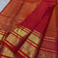Detailed vermilion-red and gold contrast border with ornamental kodi butta work and gold zari bands.